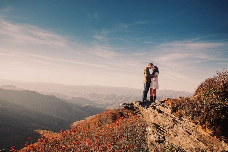 Engagement photos with mountains in the background on the Blue Ridge Parkway. Photography by Kathy Beaver
