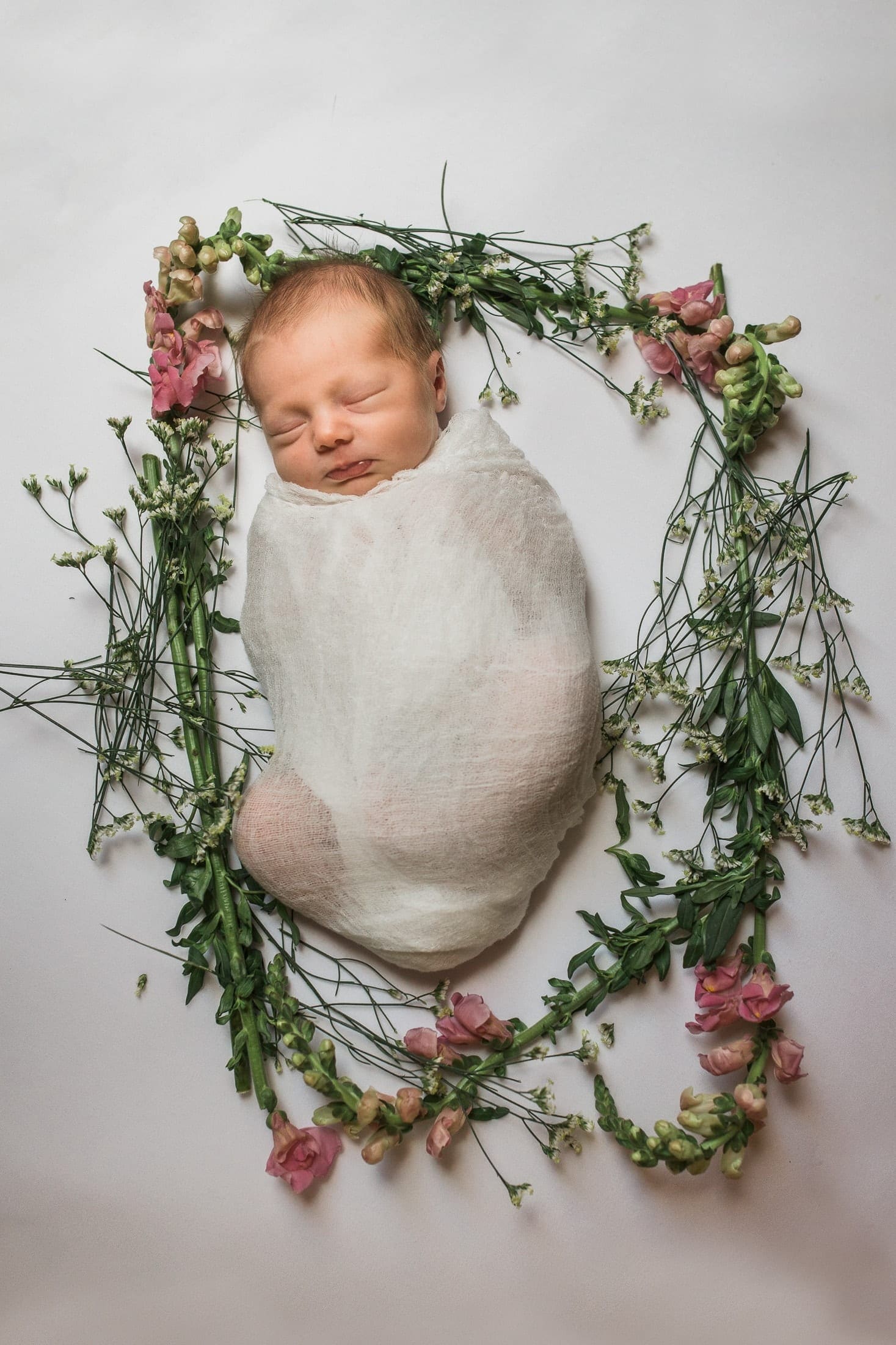 Baby surrounded by flowers