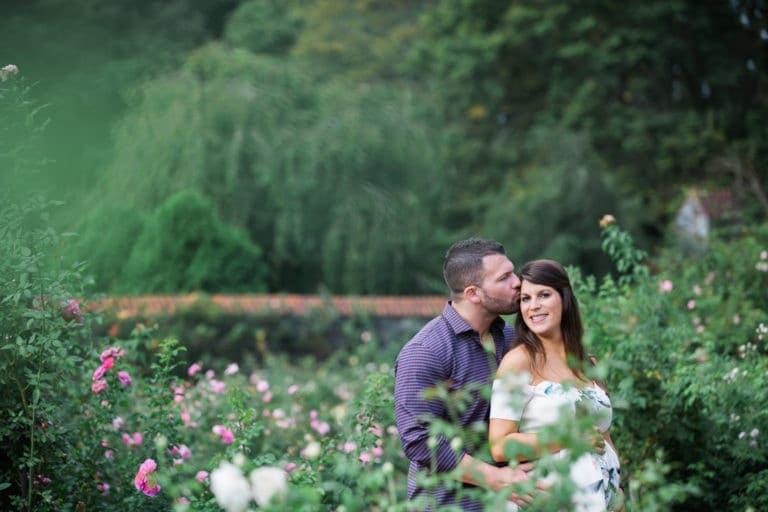 Couple in roses maternity pictures