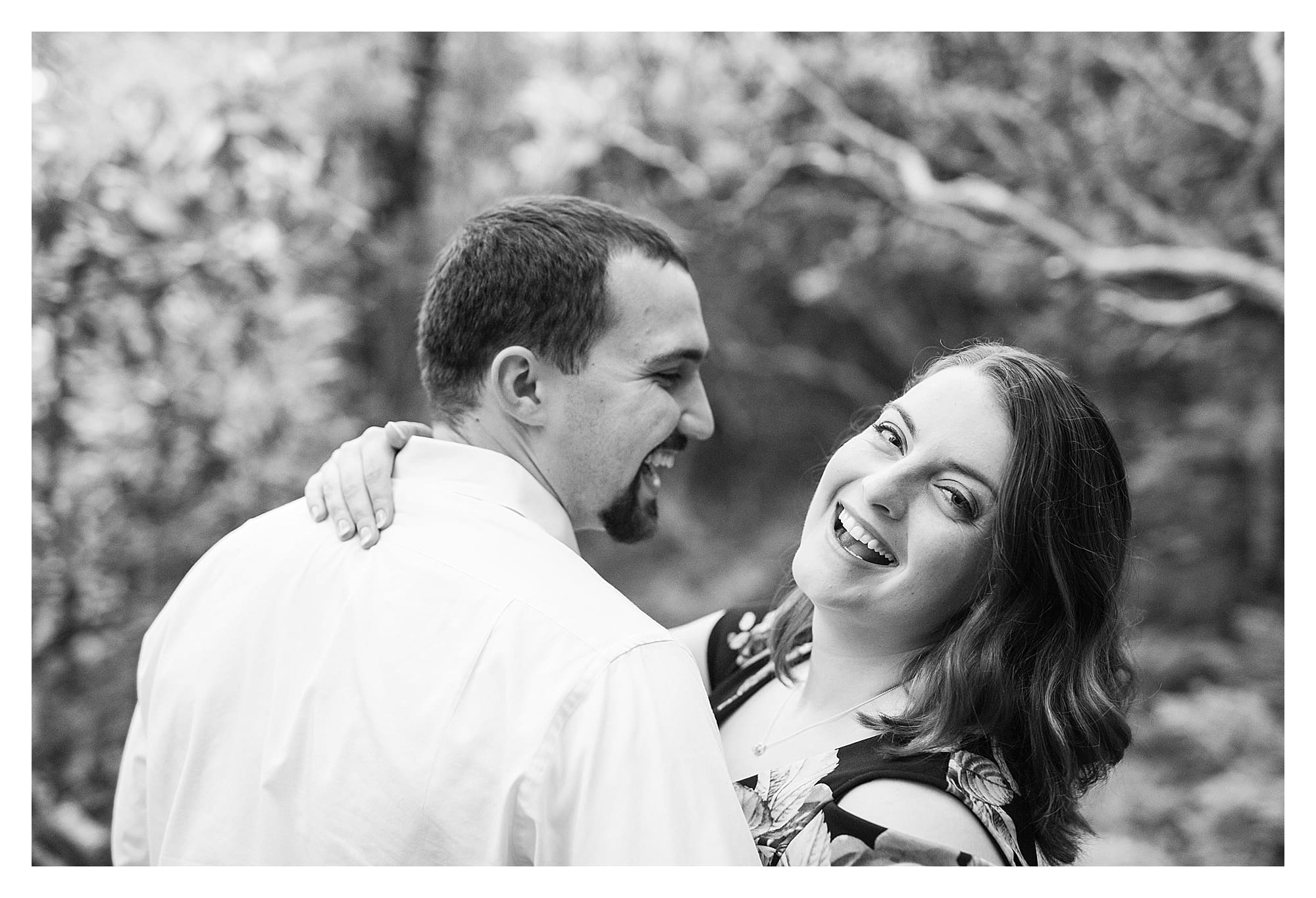 Black and white photo of couple laughing