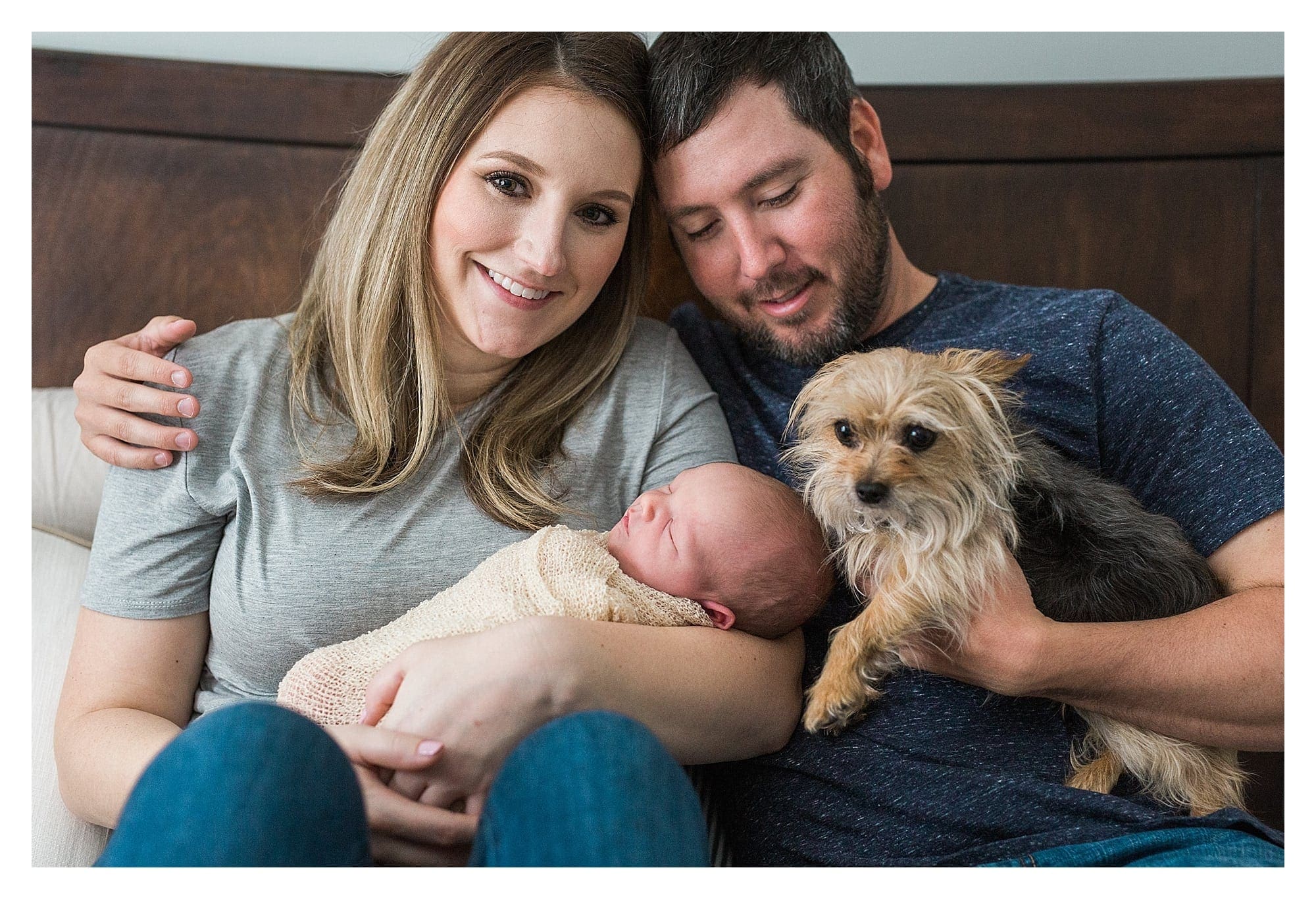 Newborn with parents and family dog