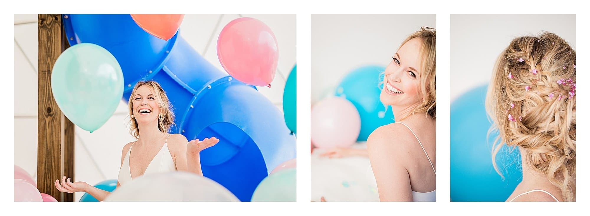 Bride in wedding dress laughing surrounded by many multi colored balloons