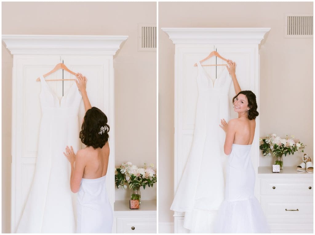 The bride picks up her dress in preparation for her wedding day | Charleston Wedding Photographer 