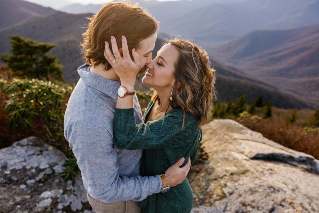 Bethany and Andy share a kiss at the blue ridge parkway | Asheville Engagement Photographer
