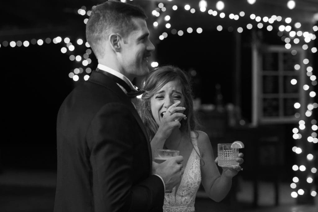 The bride laughs during toasts | Kathy Beaver Photography | Asheville Wedding Photographer