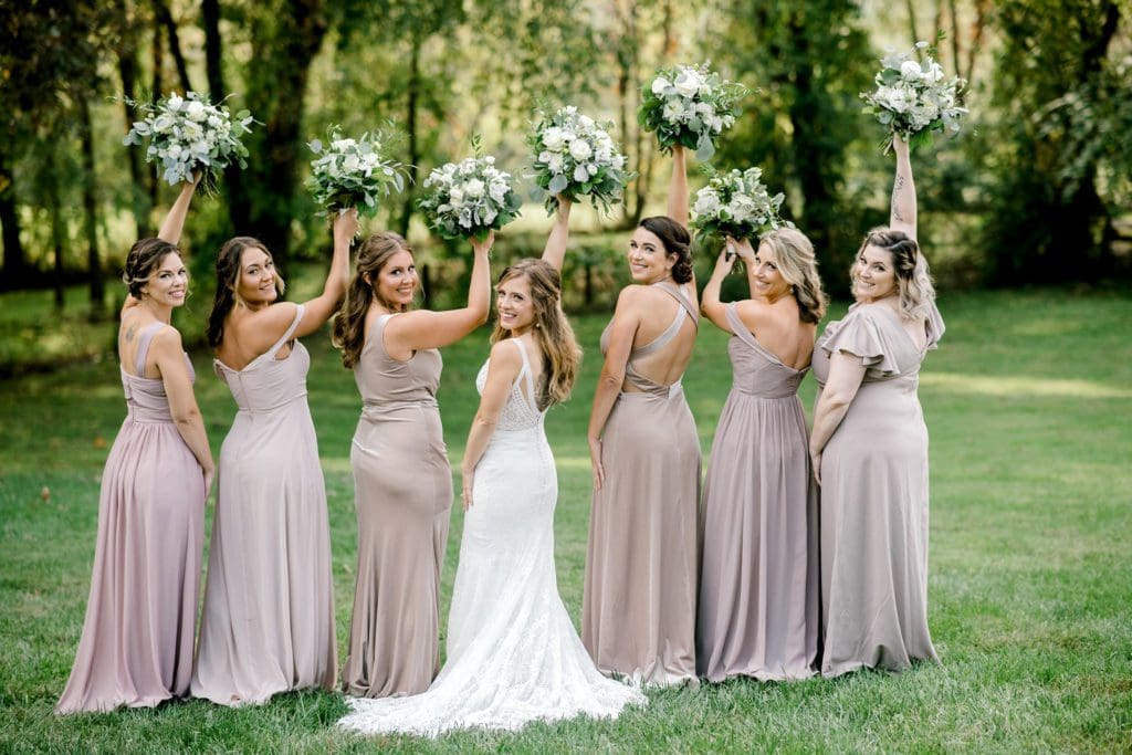 The bridesmaids show off the back of their dresses | Kathy Beaver Photography | Asheville Wedding Photographer