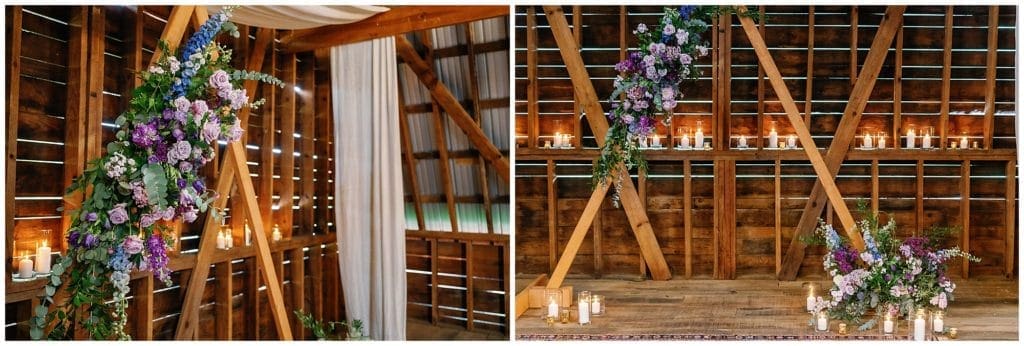 A triangle ceremony arch with candles inside a rustic barn at Honeysuckle Hill  | Asheville Wedding Photographer