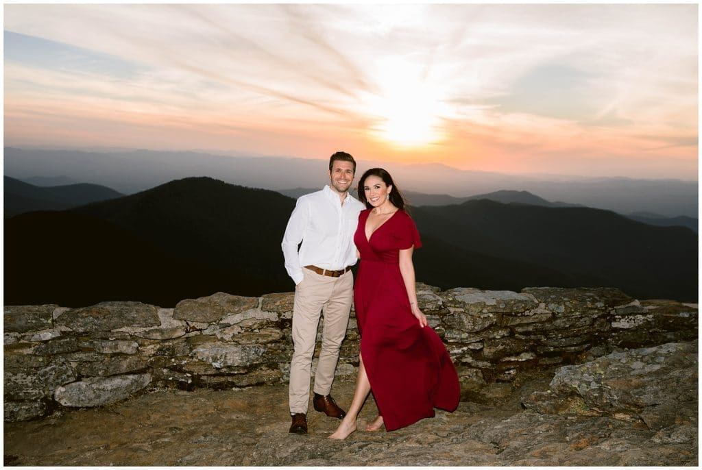 Nicole and Steve at Craggy Gardens with a colorful sunset behind them for engagement photos | Asheville Engagement Photographer