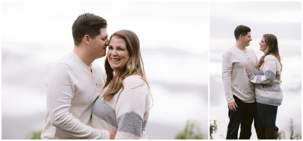 Engagement photos on the blue ridge parkway in the fog wearing white sweaters | Asheville Wedding Photographer