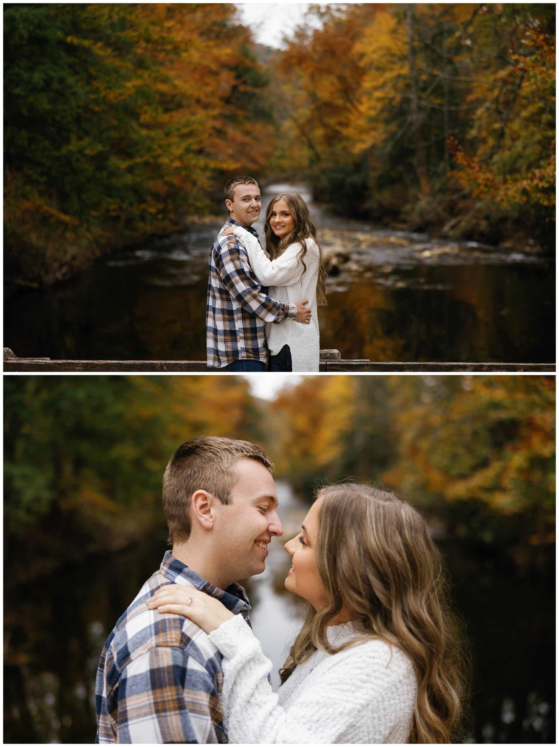 Couple snuggling in front of river and fall leaves during their mountain engagement