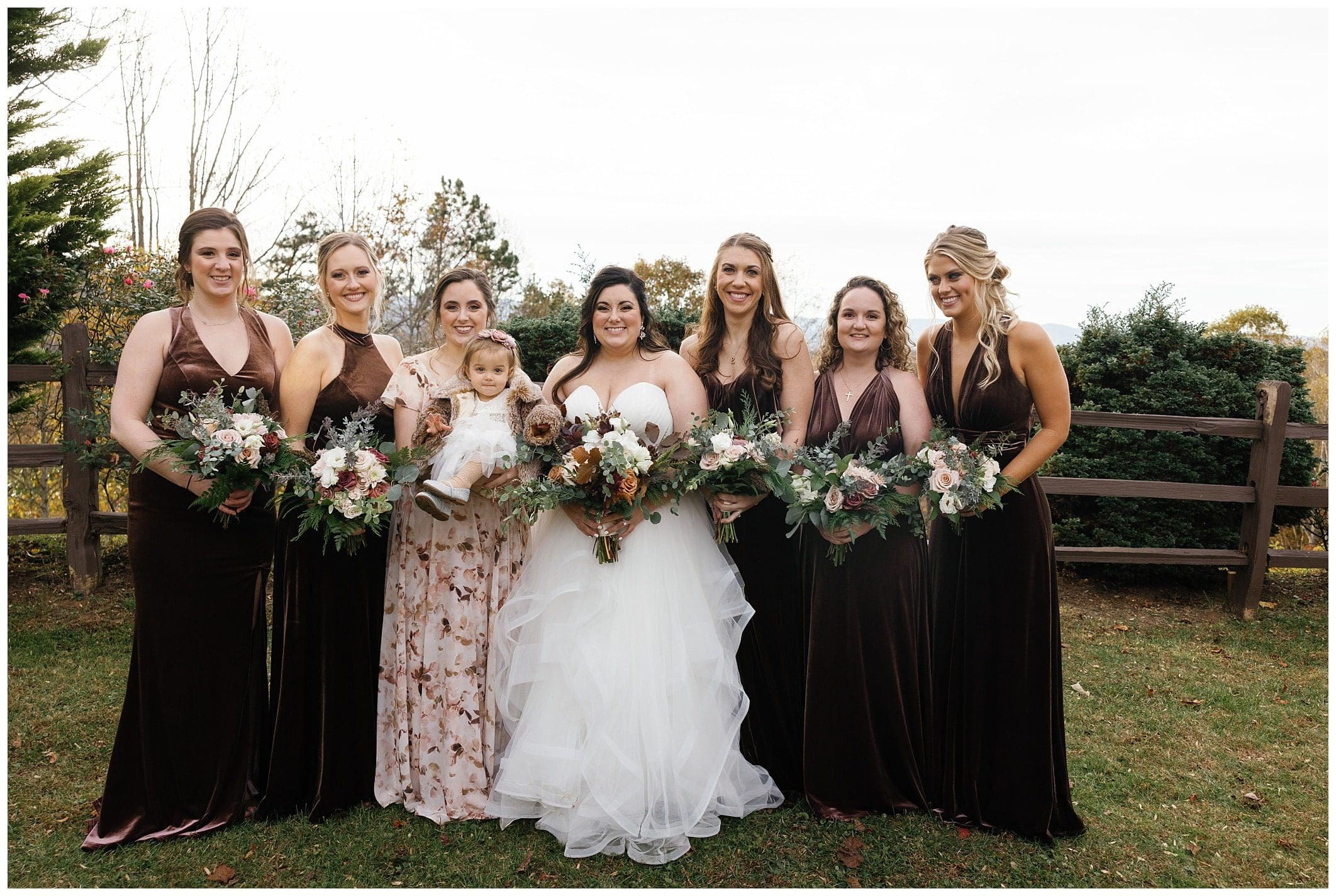 bride and bridesmaids in brown velvet dresses holding bouquets for a November wedding