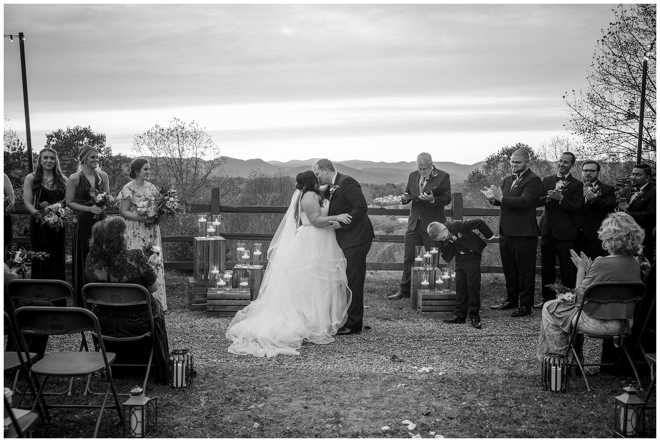 black and white photo of couple getting married outdoors in front of mountains for their November wedding