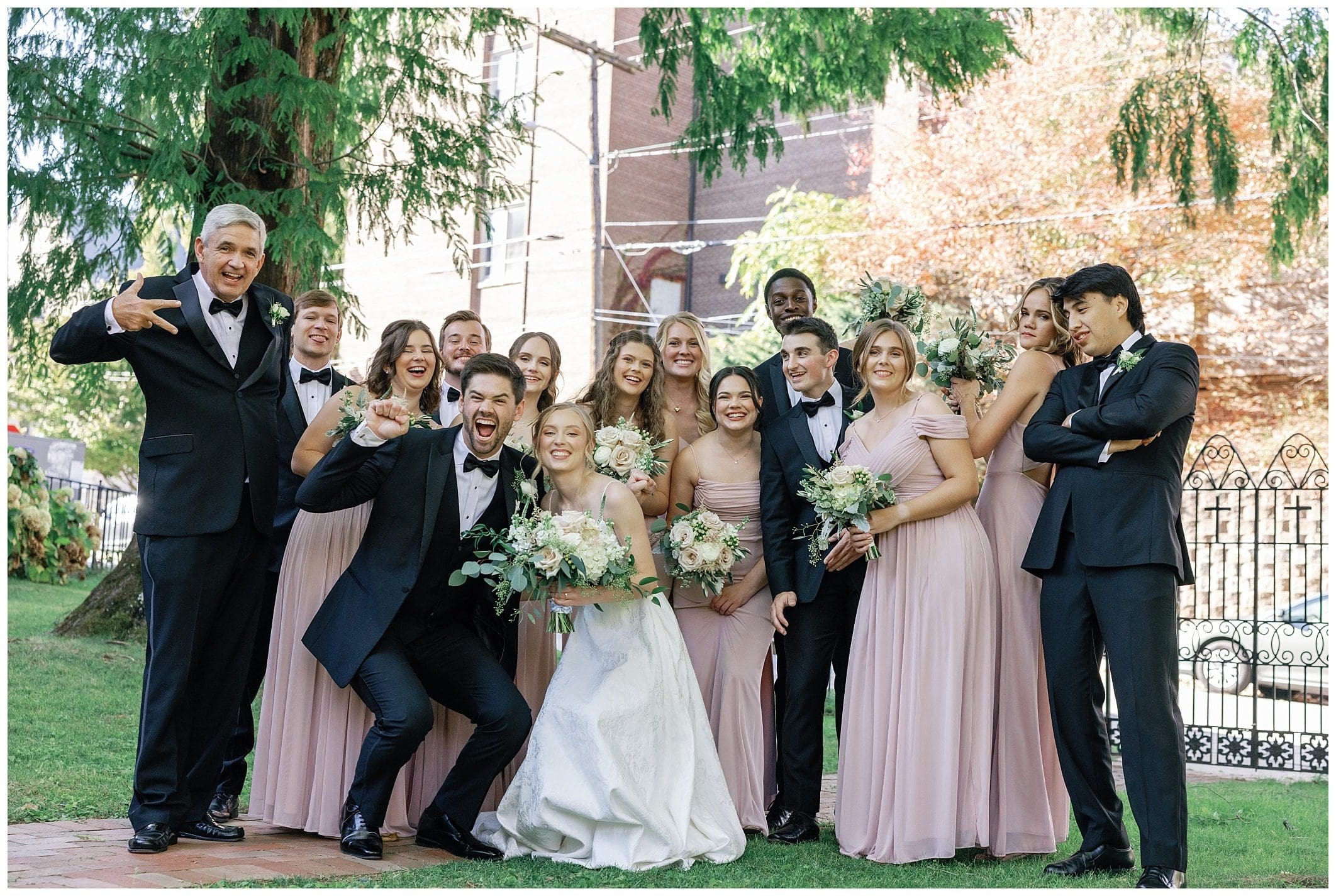 fun wedding party poses for downtown Asheville wedding