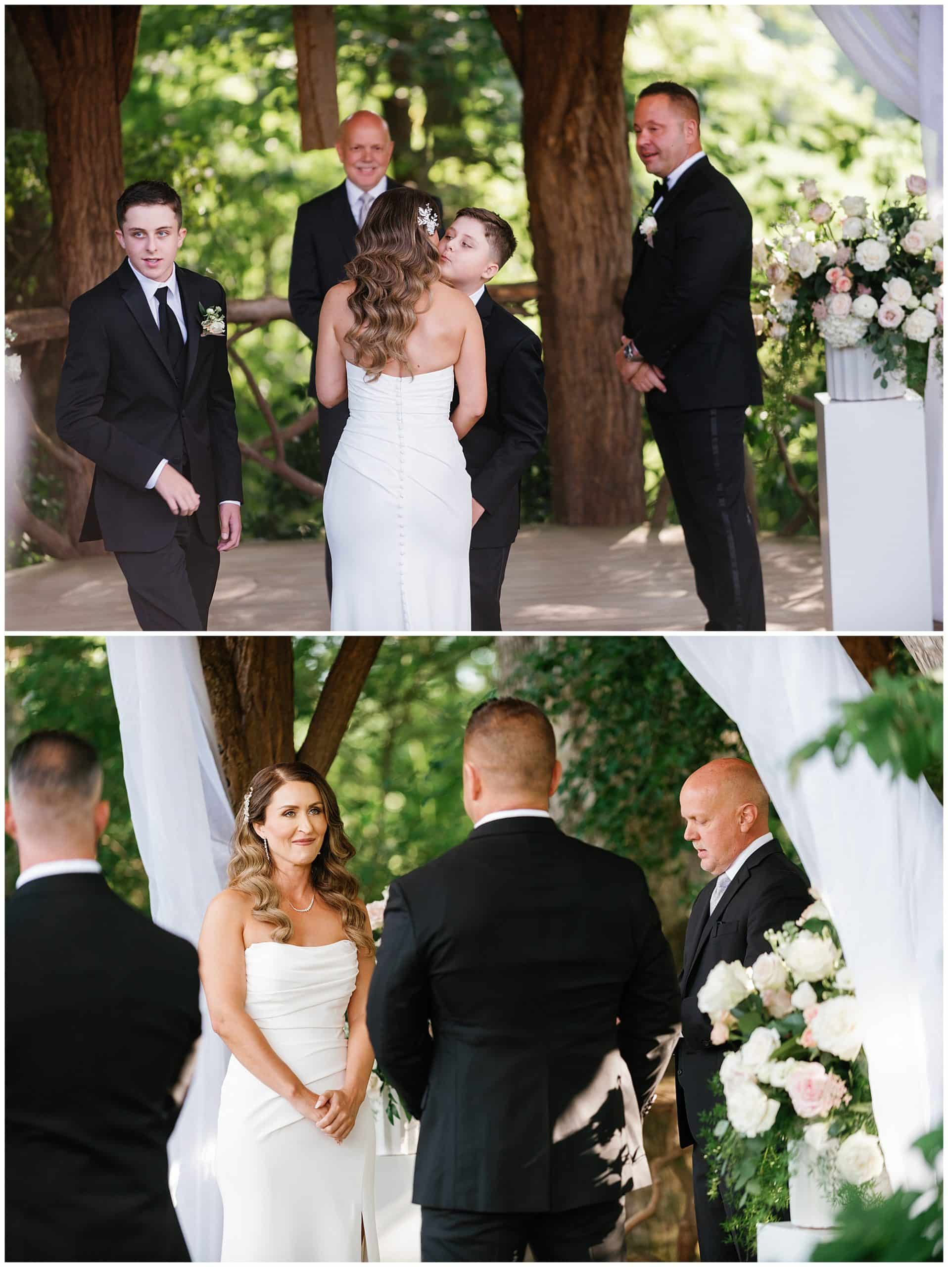 Bride's son gives her a kiss on the cheek after walking her down the aile at their summer wedding