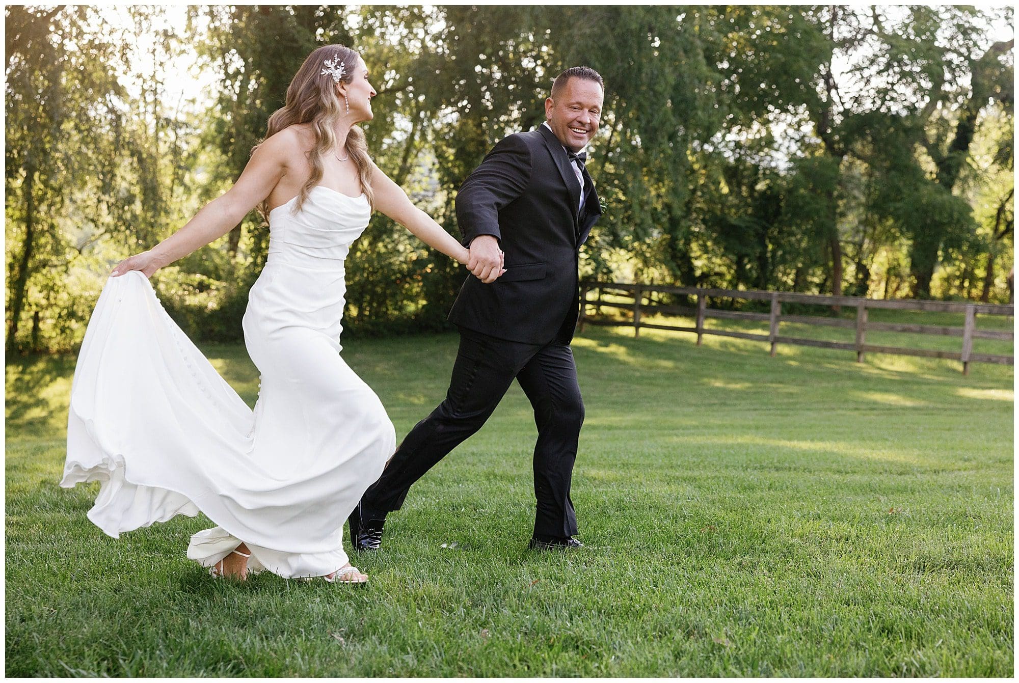Bride and groom hold hands and run together during couple photos at sunset. Kathy Beaver Asheville Wedding photographer