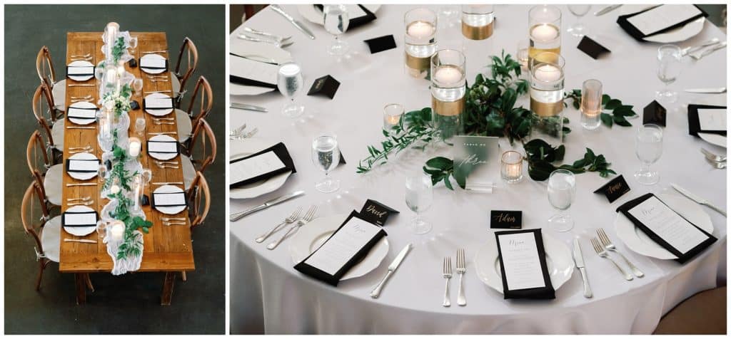 A black and white table setting with greenery and candles.