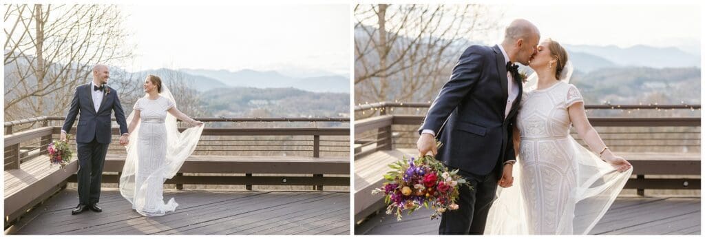 A bride and groom kissing on a deck overlooking the mountains.