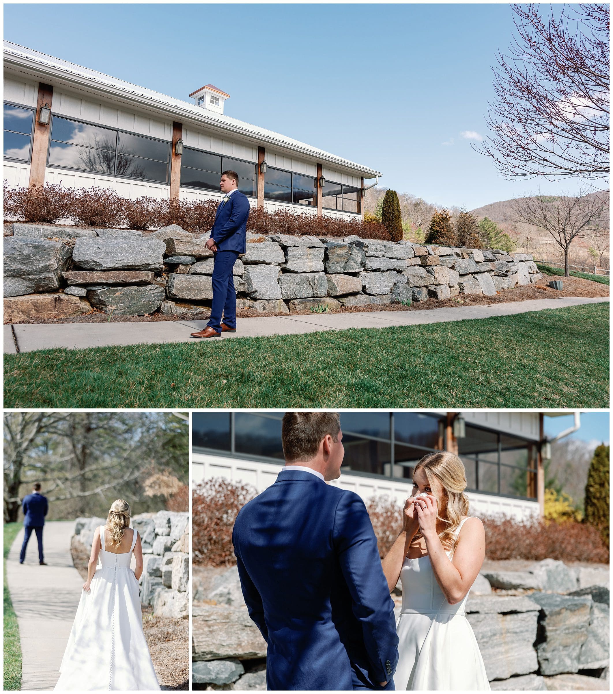 A bride and groom look at each other in front of a stone wall.