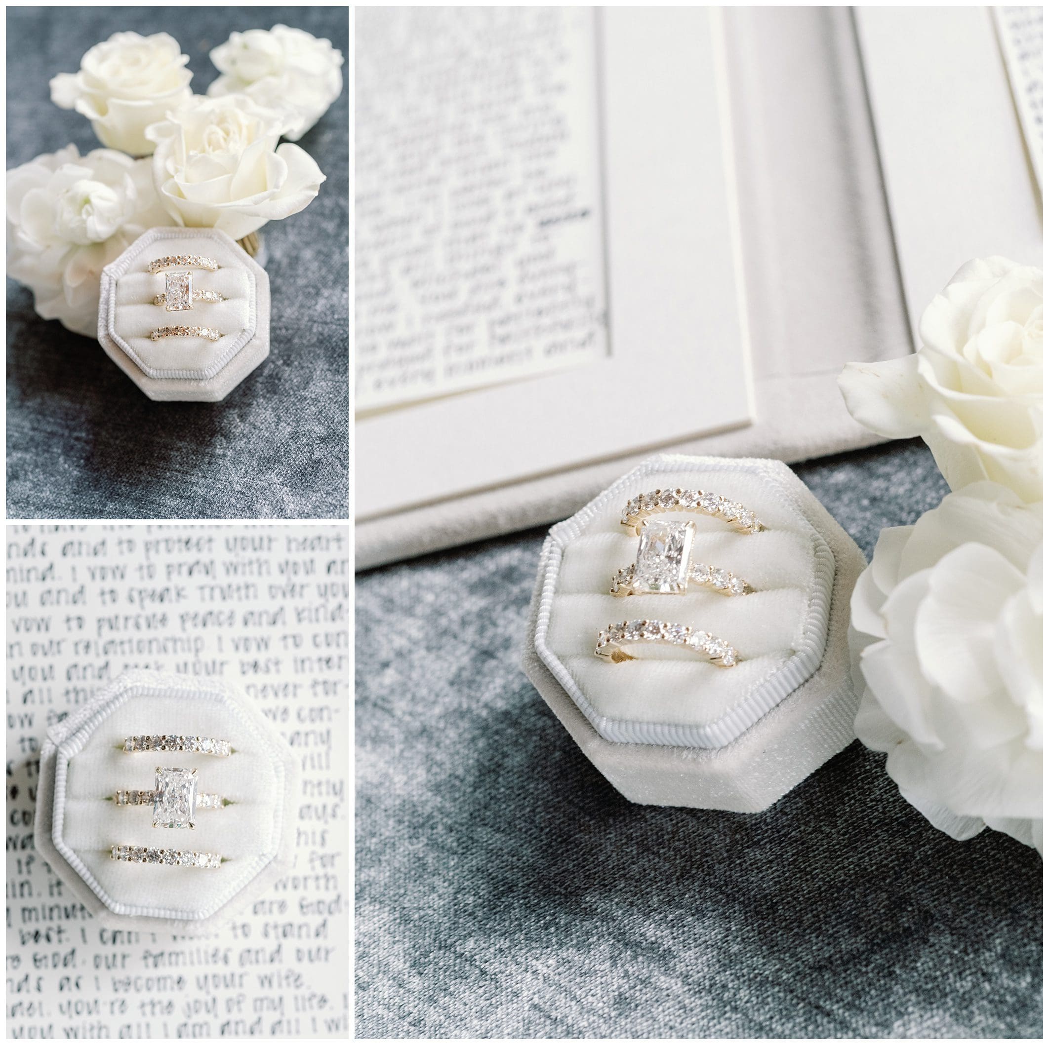 Flat lay image of an open vow book, elegant white flowers, and a velvet jewelry case holding diamond rings on a textured gray surface.