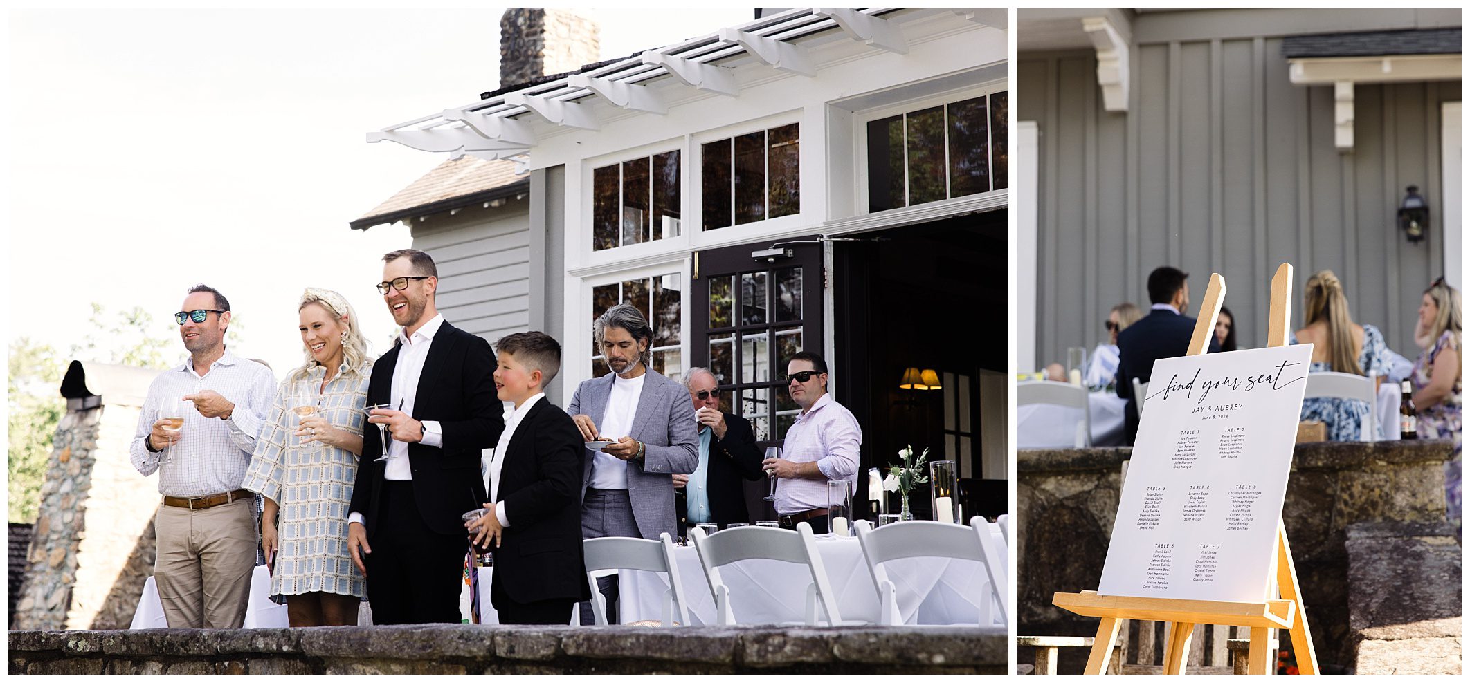 An intimate Summer wedding at Greystone Inn A group of people, some dressed in formal attire, stand and chat near a building with large windows. To the right, a seating chart on an easel lists guest names and table assignments.