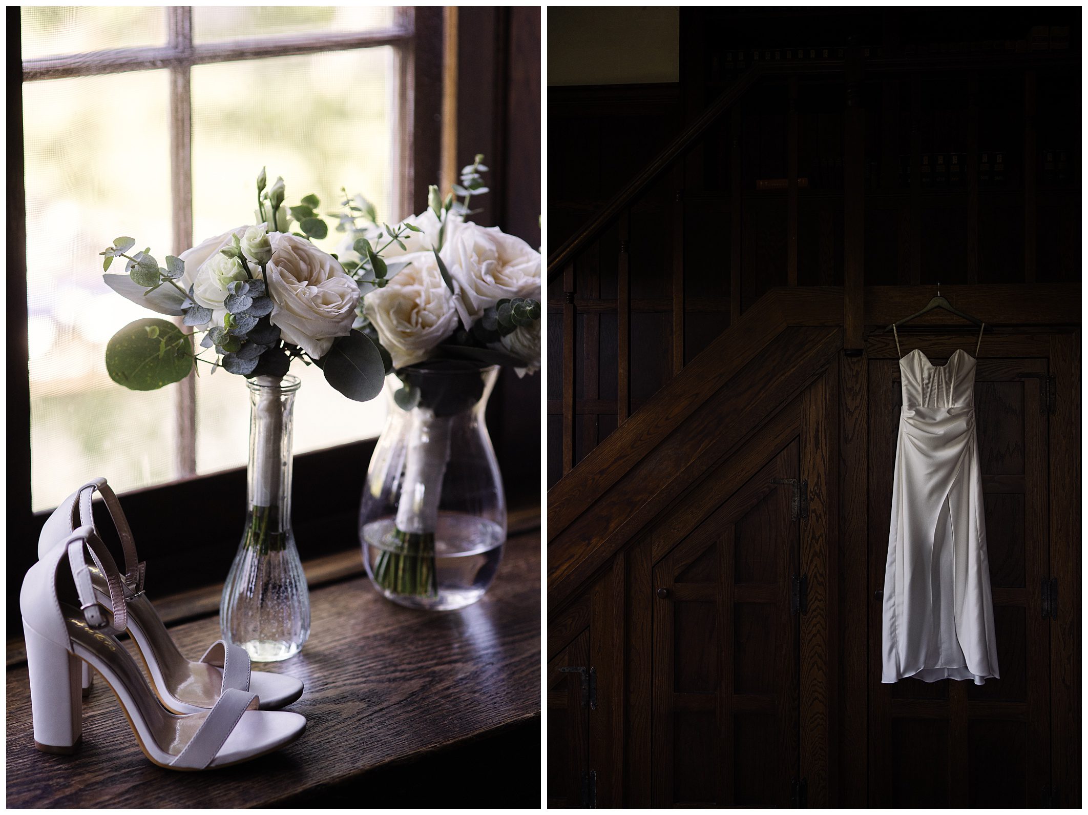 A pair of white high-heeled shoes, glass vases with white flowers, and a white satin dress hanging by a wooden staircase.