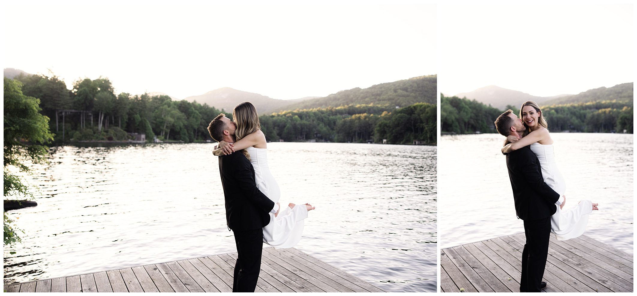 A man in a suit lifts a woman in a white dress on a wooden dock by a lake, with trees and mountains in the background. Both are smiling and looking at each other.