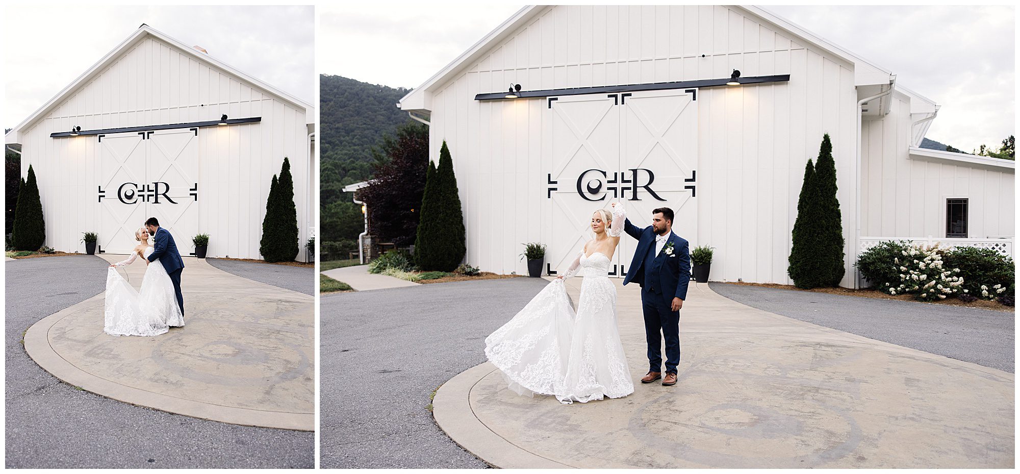 A bride and groom hold hands and dance outside a large, white barn with decorative double doors. The groom wears a blue suit, and the bride wears a white gown.