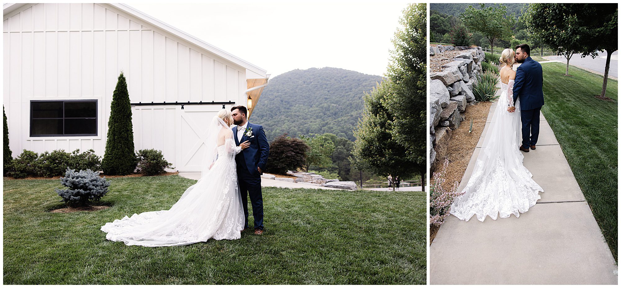 A couple in wedding attire poses near a white barn and on a pathway with mountain scenery in the background. The bride's dress features a long lace train.