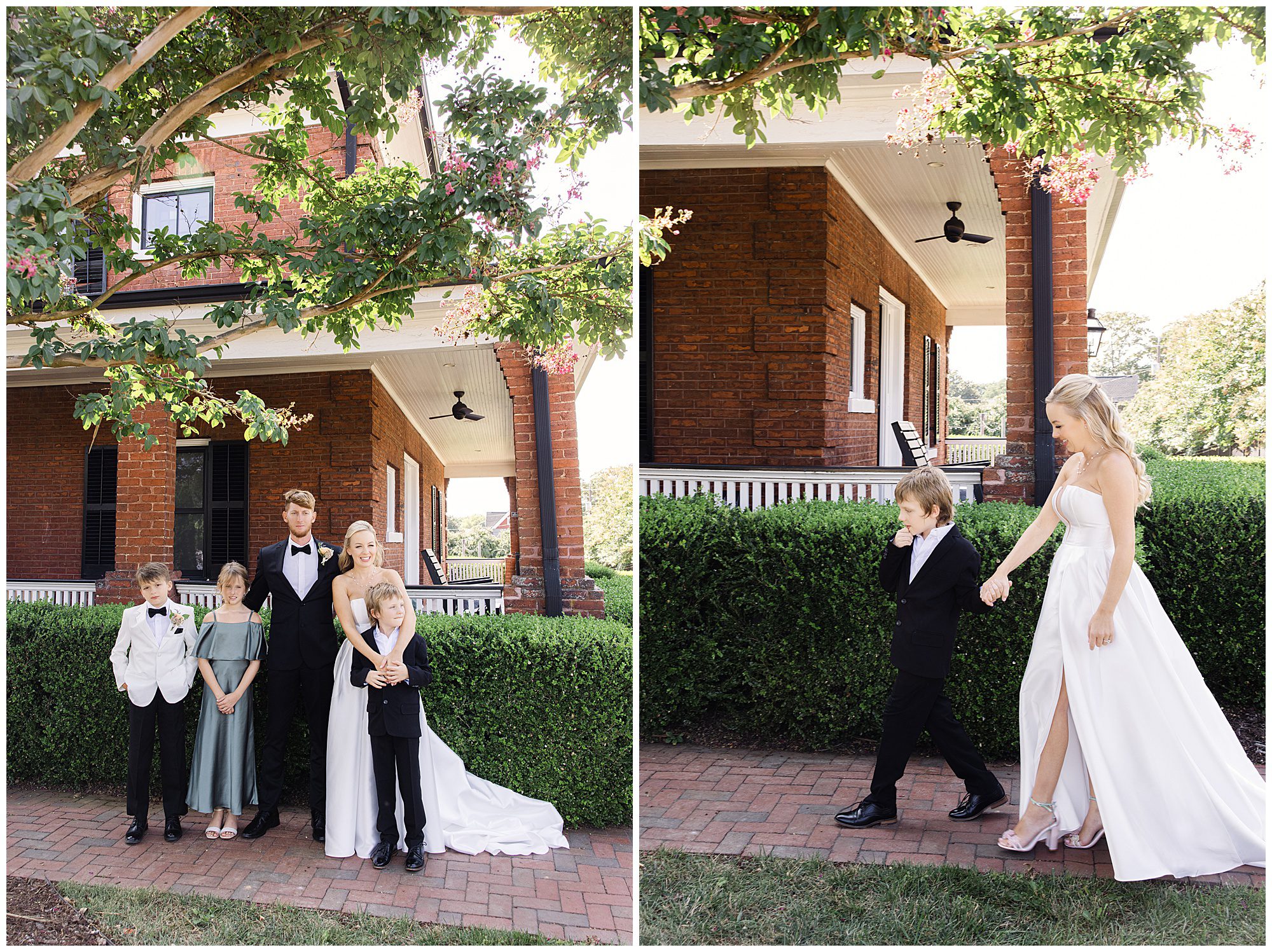 Group photo in front of a brick house: A family posing for a formal photo on the left and a woman in a white dress walking with a child in a suit on the right.