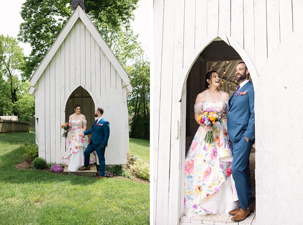 A couple in formal attire stands and smiles together at the entrance of a small white chapel, with the bride holding a colorful bouquet—perfect for a Spring Garden Wedding in Asheville NC.