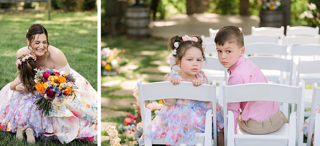 At a Spring garden wedding in Asheville NC, a woman in a floral dress hugs a young girl wearing a flower crown; two children sit on white chairs—one girl looks serious, while the boy gazes at the camera.