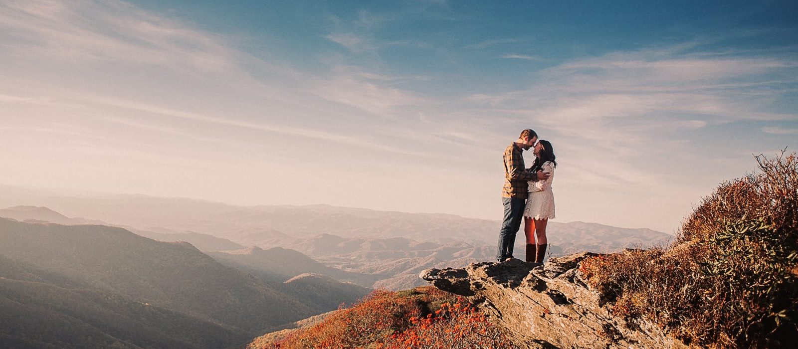 Engagement photos with mountains in the background on the Blue Ridge Parkway. Photography by Kathy Beaver