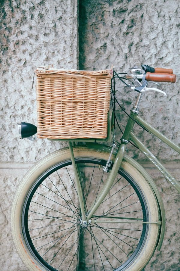 2024 Winter Content Creation Retreat featuring a green bicycle with a basket attached.